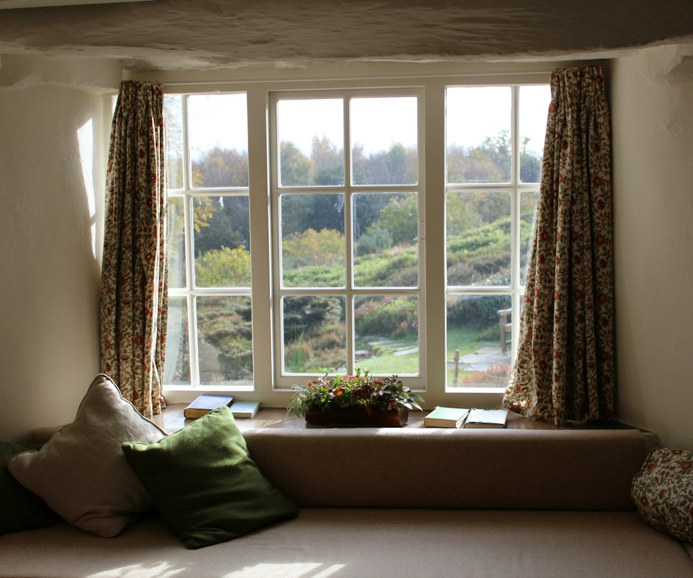 Bright living room with large modern windows and curtains